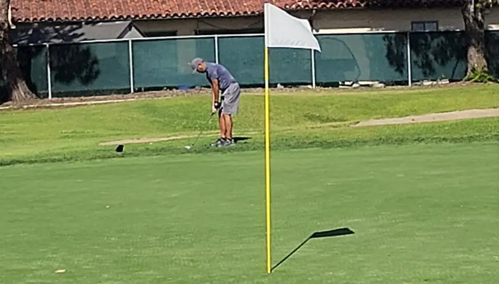 short game for golfers over 50 - competitive amateur practicing chipping and pitching