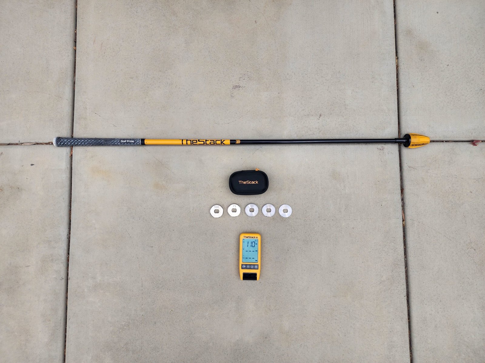 The Stack System overspeed training device with shaft, weights, sensor, and case